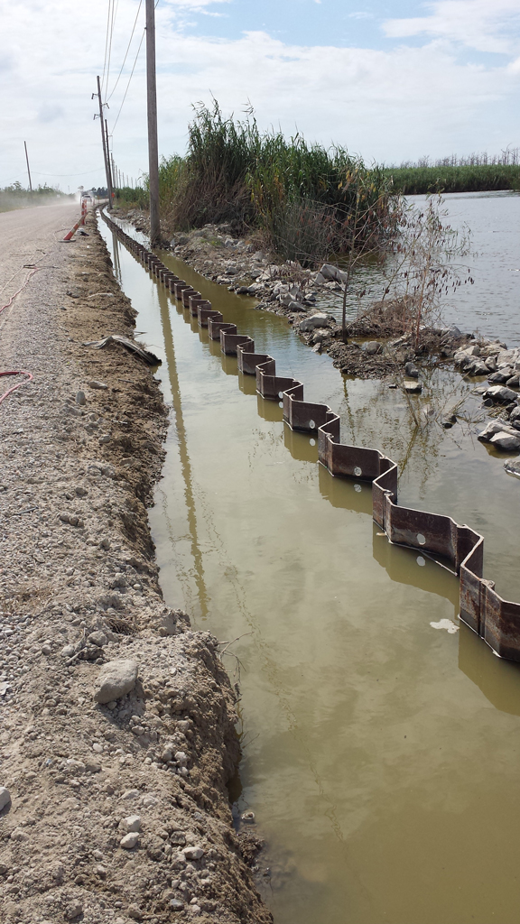 Building process of retaining walls along the road with sheet pile installation